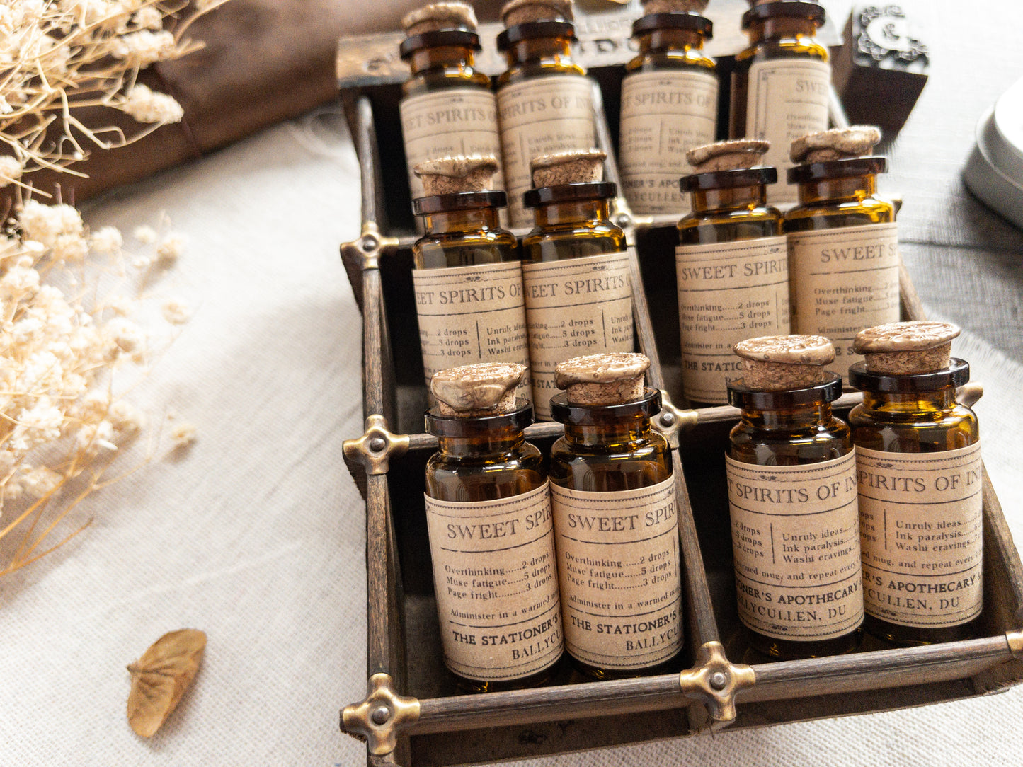 Paper clips & studs in vintage-style apothecary bottle