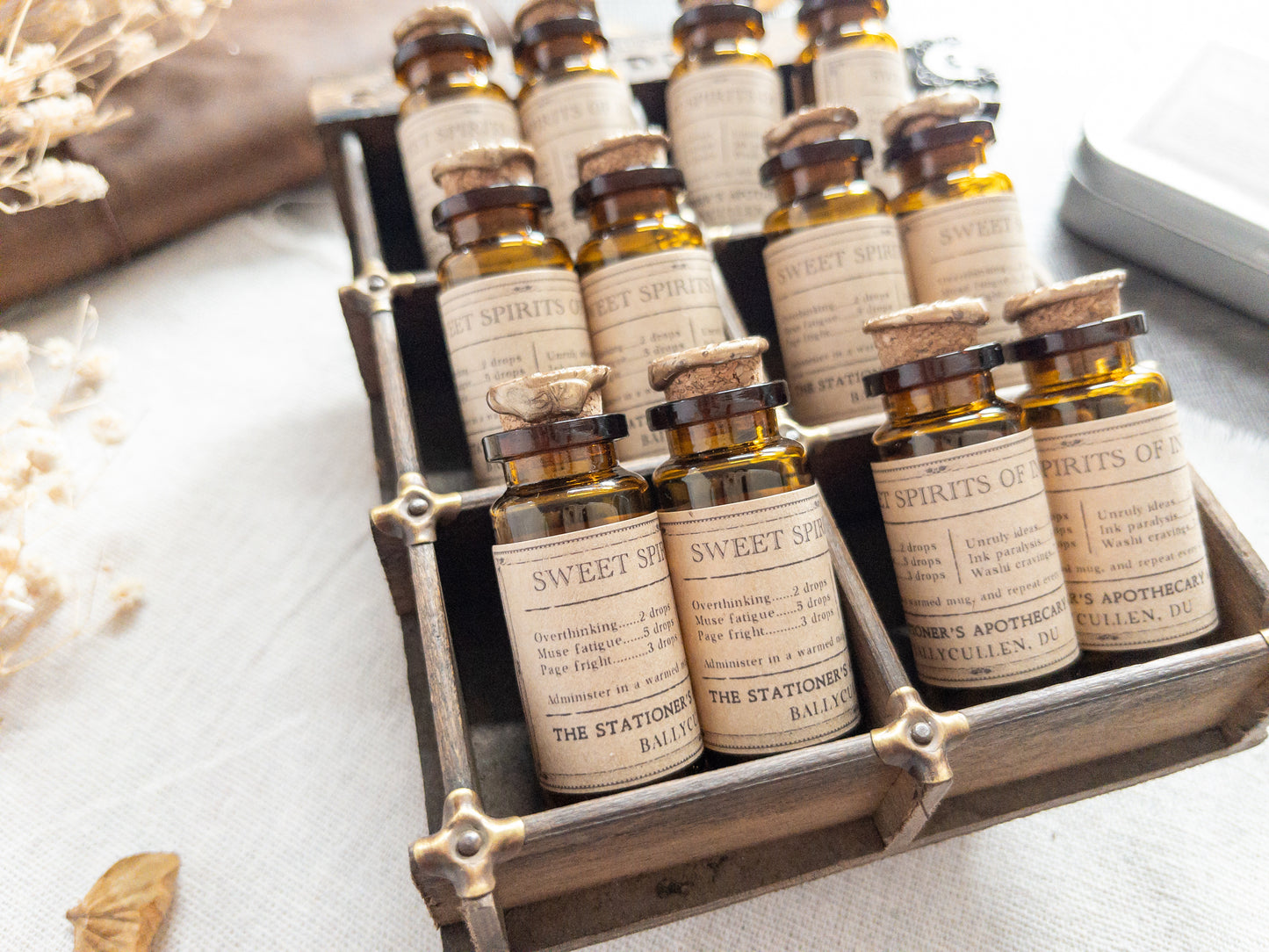 Paper clips & studs in vintage-style apothecary bottle