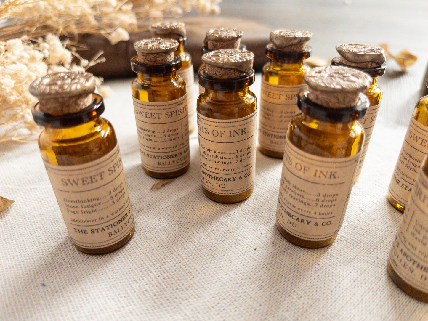 Paper clips & studs in vintage-style apothecary bottle