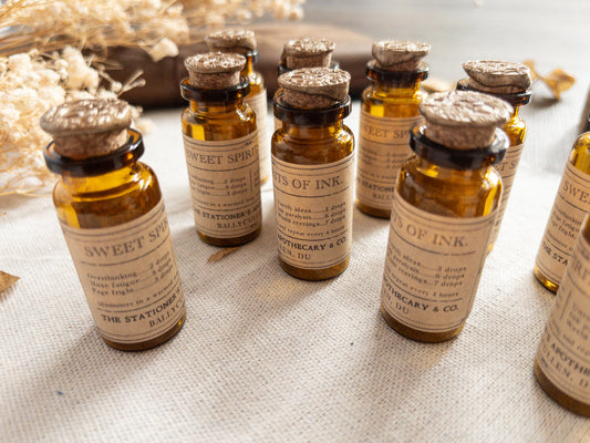 Paper clips & studs in vintage-style apothecary bottle
