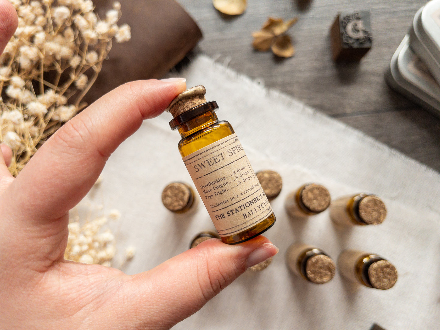 Paper clips & studs in vintage-style apothecary bottle